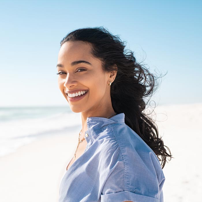 smiling young woman on beach