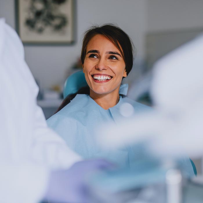 smiling woman in dental chair